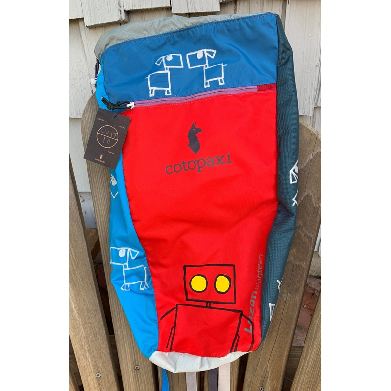 Red Robot and Dogs on a backpack